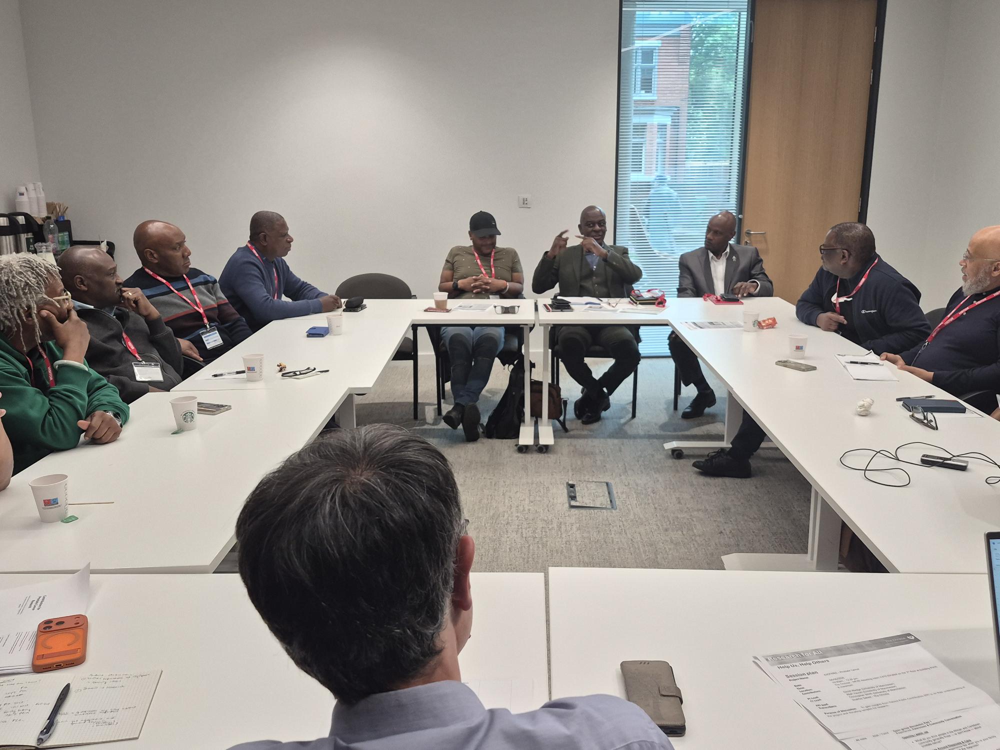 Community members discussing prostate cancer research